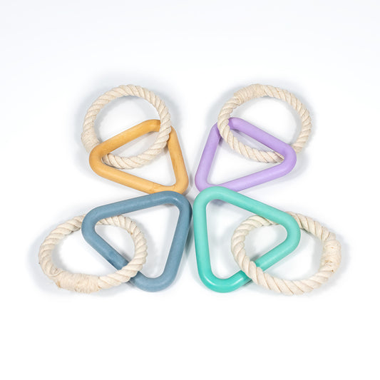 The perfect toy to play with your dog while both of you engage and are entertained. The Woof Triangle The triangle is made of natural rubber with a reinforced core for added strength. The rope is natural cotton. Grab the matching Woof collection (collar, leash and poop bag carrier) to complete your set.