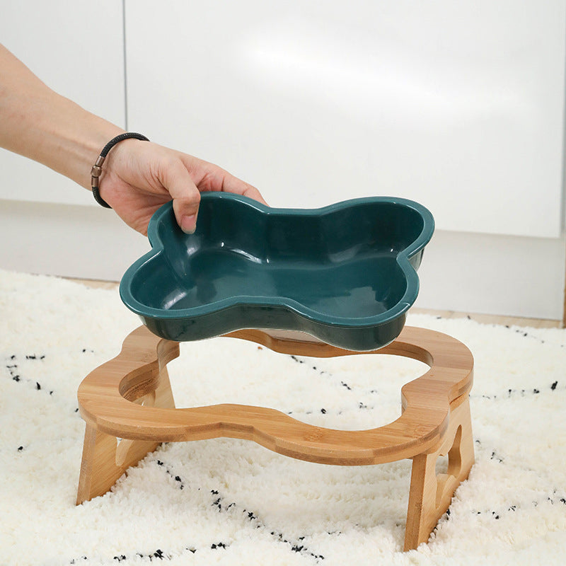 Serve your dog food in this appealing bone shaped bowl. Thanks to its elevation, this dog bowl will help support proper swallowing and healthy digestion. It relieves stress on your dog's shoulders and beck. This bone shaped dog bowl is sturdy, beautifully designed and comes in different colors.